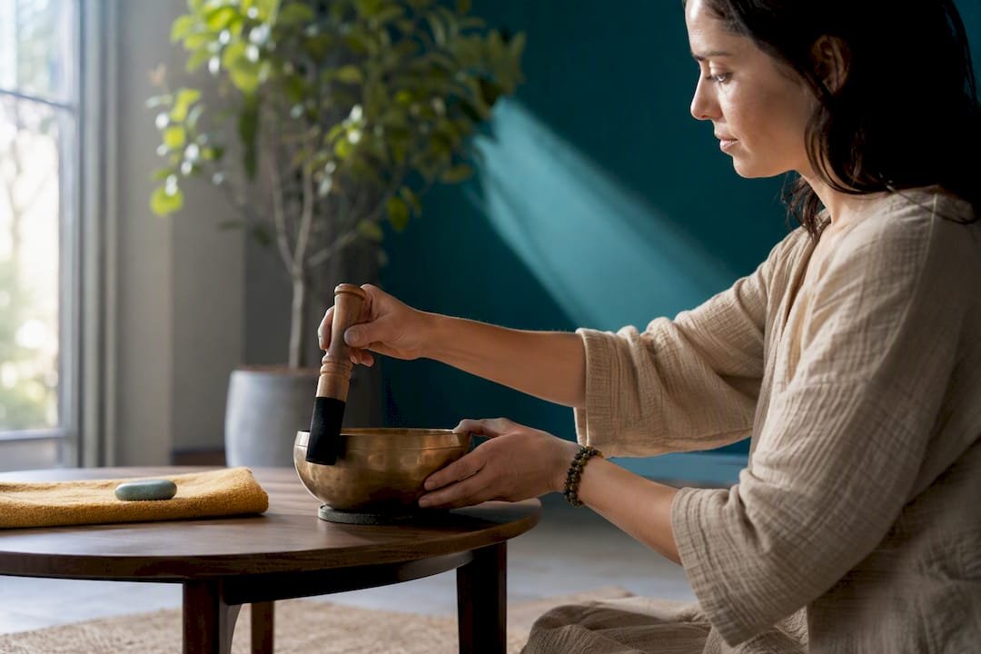 Ritual First Daily Body Energy Cleanse in 5–10 Minutes 1 Person playing a singing bowl