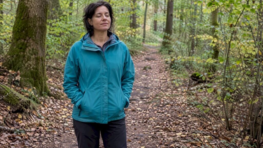 Woman practicing visualization on a forest path
